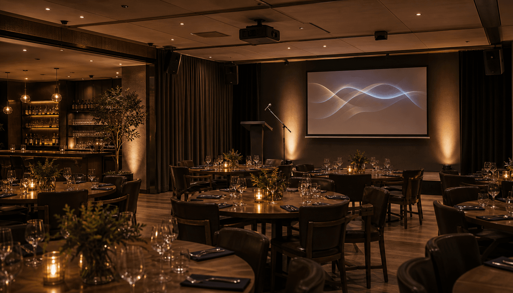 Restaurant banquet setup with presentation screen and microphone